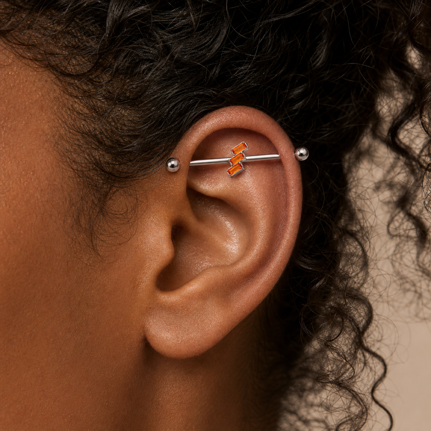 G23 Titanium Three Baguette Industrial Barbell Earring worn on ear in clean window daylight