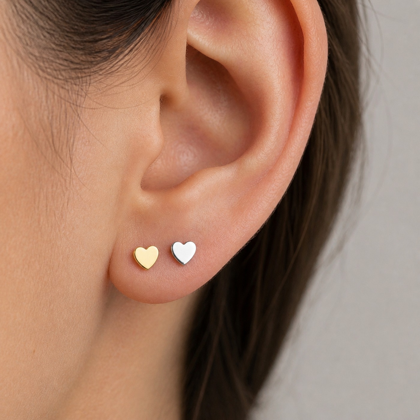 Titanium Stud Earrings Tiny Heart for Sensitive Ears worn on one ear