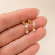 Titanium Stud Earrings Teardrop Dangle for Sensitive Ears shown at fingertip scale