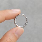 Titanium Hoop Earrings Rooftop for Sensitive Ears shown at fingertip scale