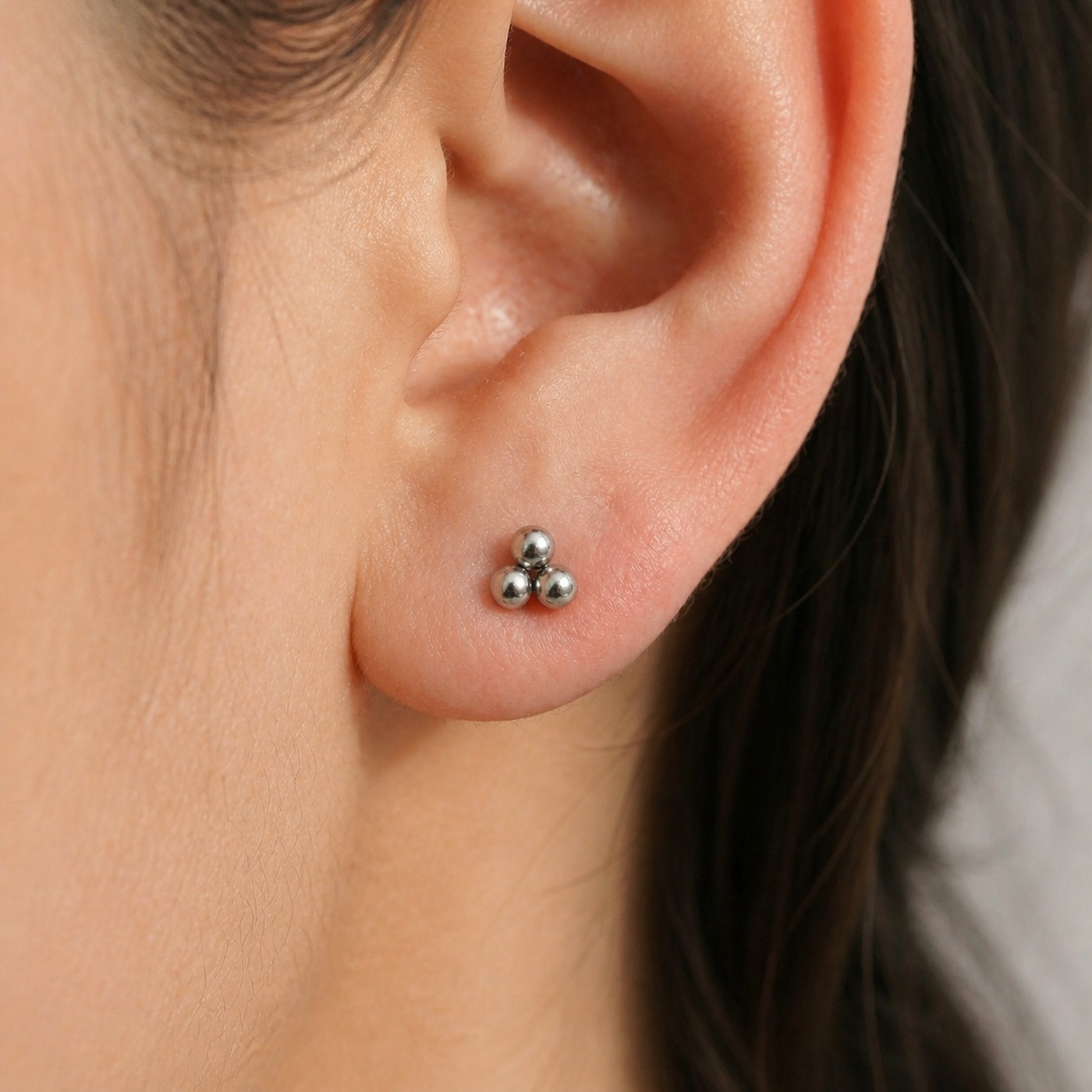 Titanium Stud Earrings Tridot for Sensitive Ears worn on one ear