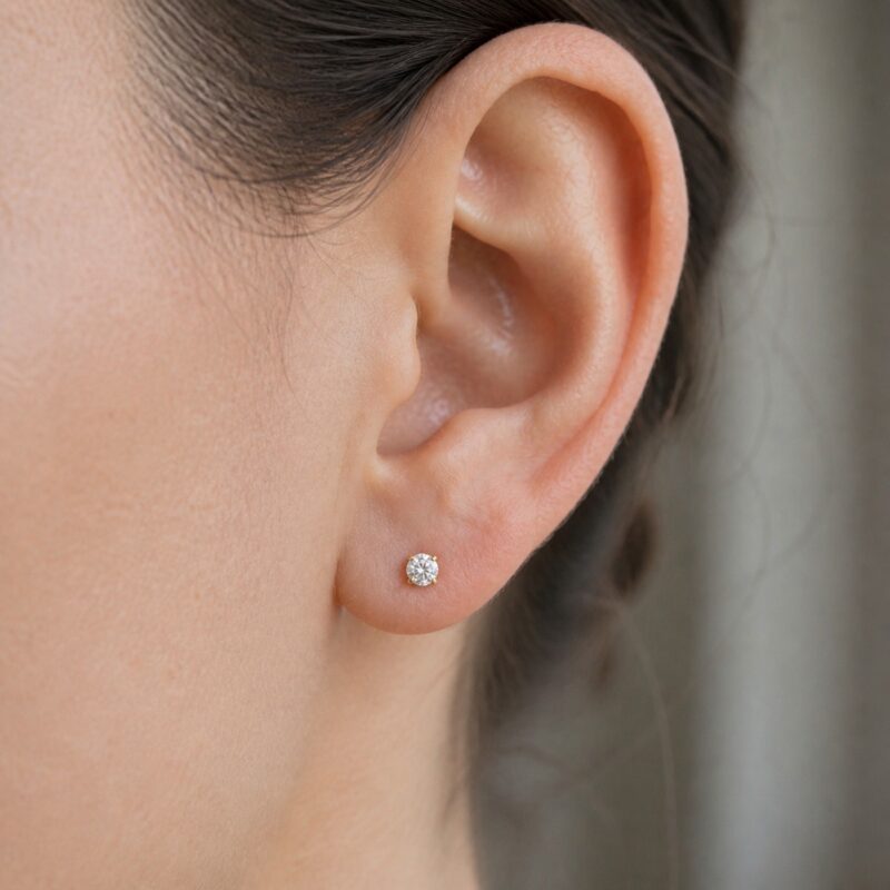 Flat Back Stud Earrings Small Solitaire in F136 Titanium worn on one ear