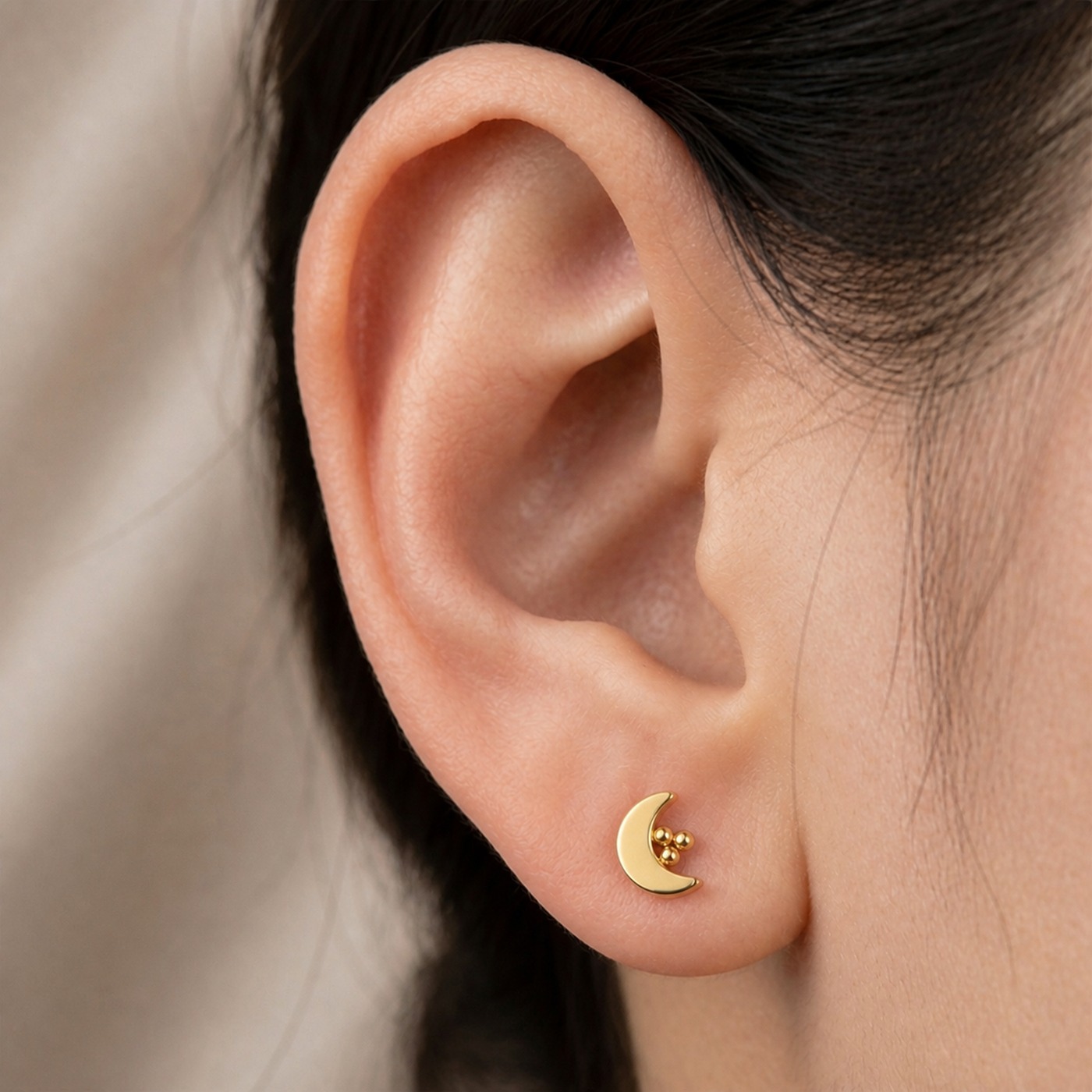 Flat Back Stud Earrings Moon in F136 Titanium worn on one ear