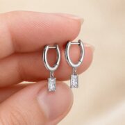 Titanium Hoop Earrings Square Zircon Dangle for Sensitive Ears shown at fingertip scale