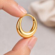 Titanium Hoop Earrings Classic for Sensitive Ears shown at fingertip scale