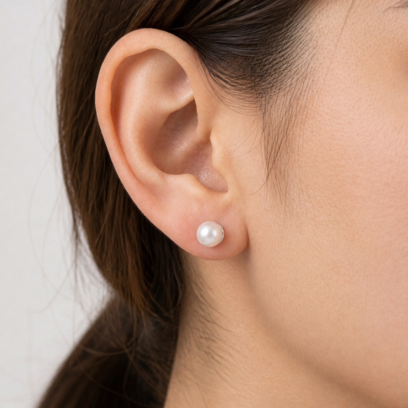 Titanium Stud Earrings Classic Pearl for Sensitive Ears worn on one ear