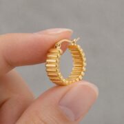 Hypoallergenic Hoop Earrings Textured Chunky with S925 Silver shown at fingertip scale