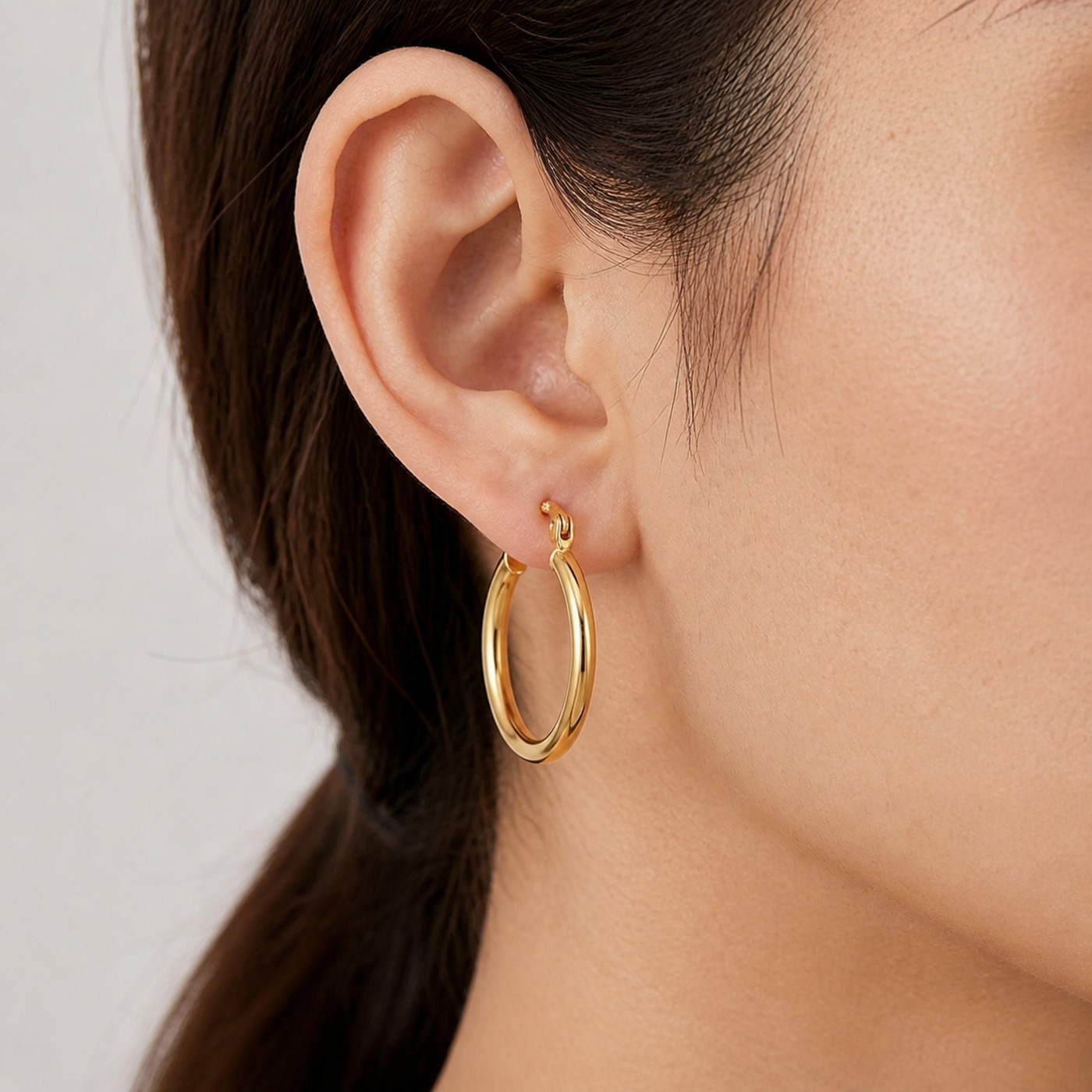 Hypoallergenic Hoop Earrings Gold with S925 Silver worn on one ear