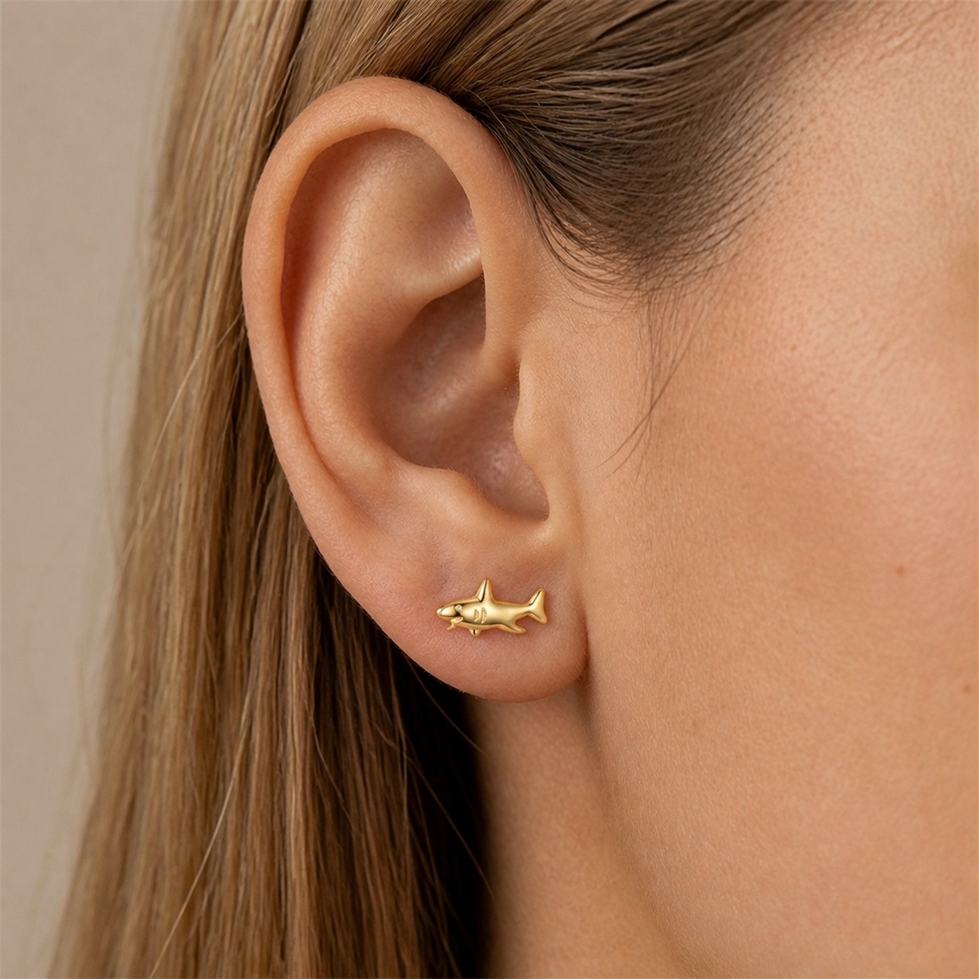 S925 Silver Tiny Animal Stud Earrings in Gold worn on one ear
