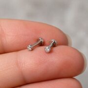Titanium Stud Earrings Toki Crystal Ear for Sensitive Ears shown at fingertip scale