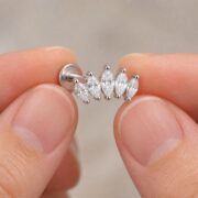 Stud Earrings Harlow Five Marquise Ear with S925 Silver shown at fingertip scale
