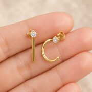 Titanium Hoop Earrings Sparkly Open for Sensitive Ears shown at fingertip scale