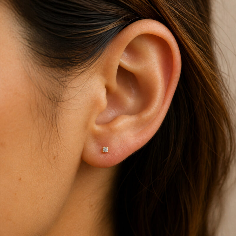 Flat Back Stud Earrings Baby Solitaire in Gold Titanium - worn on one ear