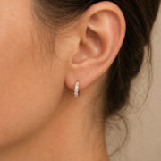 F136 Titanium Moissanite Huggie Hoop Earrings - worn on one ear