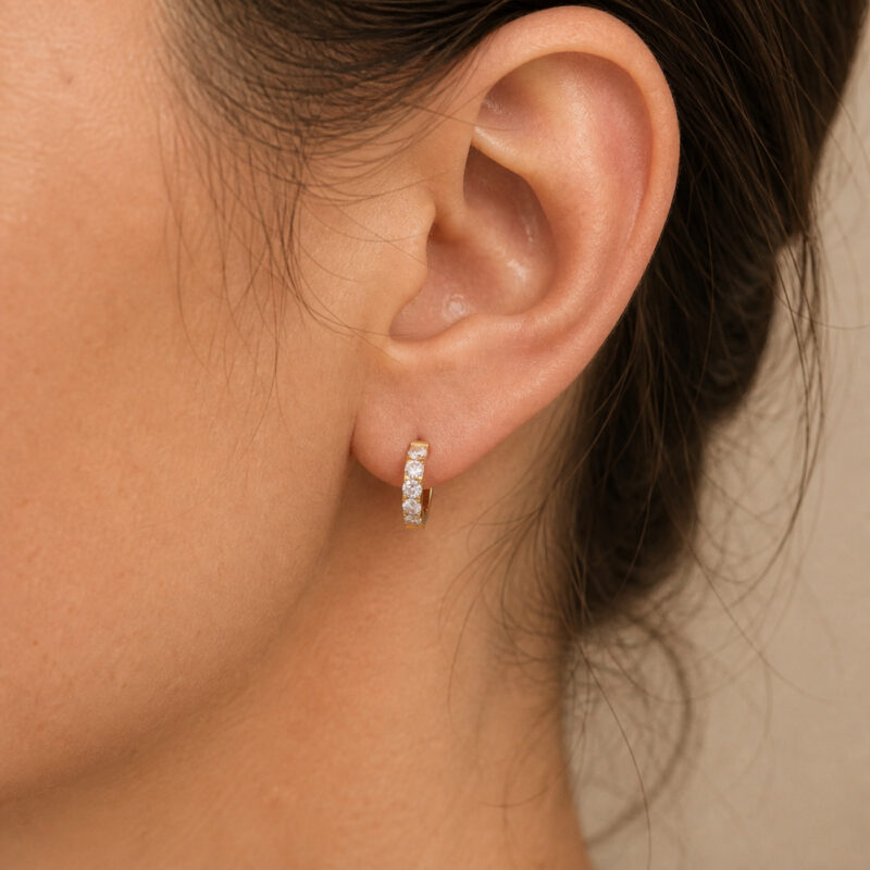 F136 Titanium Moissanite Huggie Hoop Earrings - worn on one ear