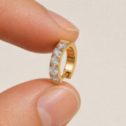 F136 Titanium Moissanite Huggie Hoop Earrings - fingertip scale view