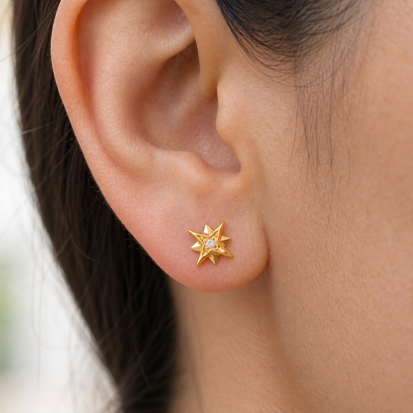 Flat Back Stud Earrings Crystal North Star in F136 Titanium worn on one ear
