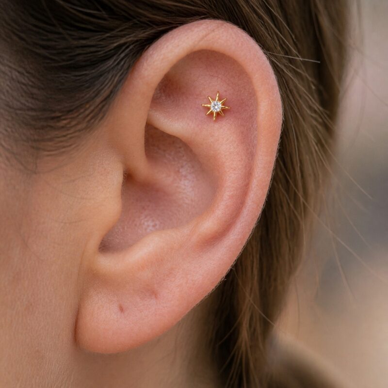 Flat Back Stud Earrings Celestial Sunburst in F136 Titanium worn on one ear