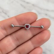 G23 Titanium Heart Crystal Industrial Barbell Earring shown at fingertip scale