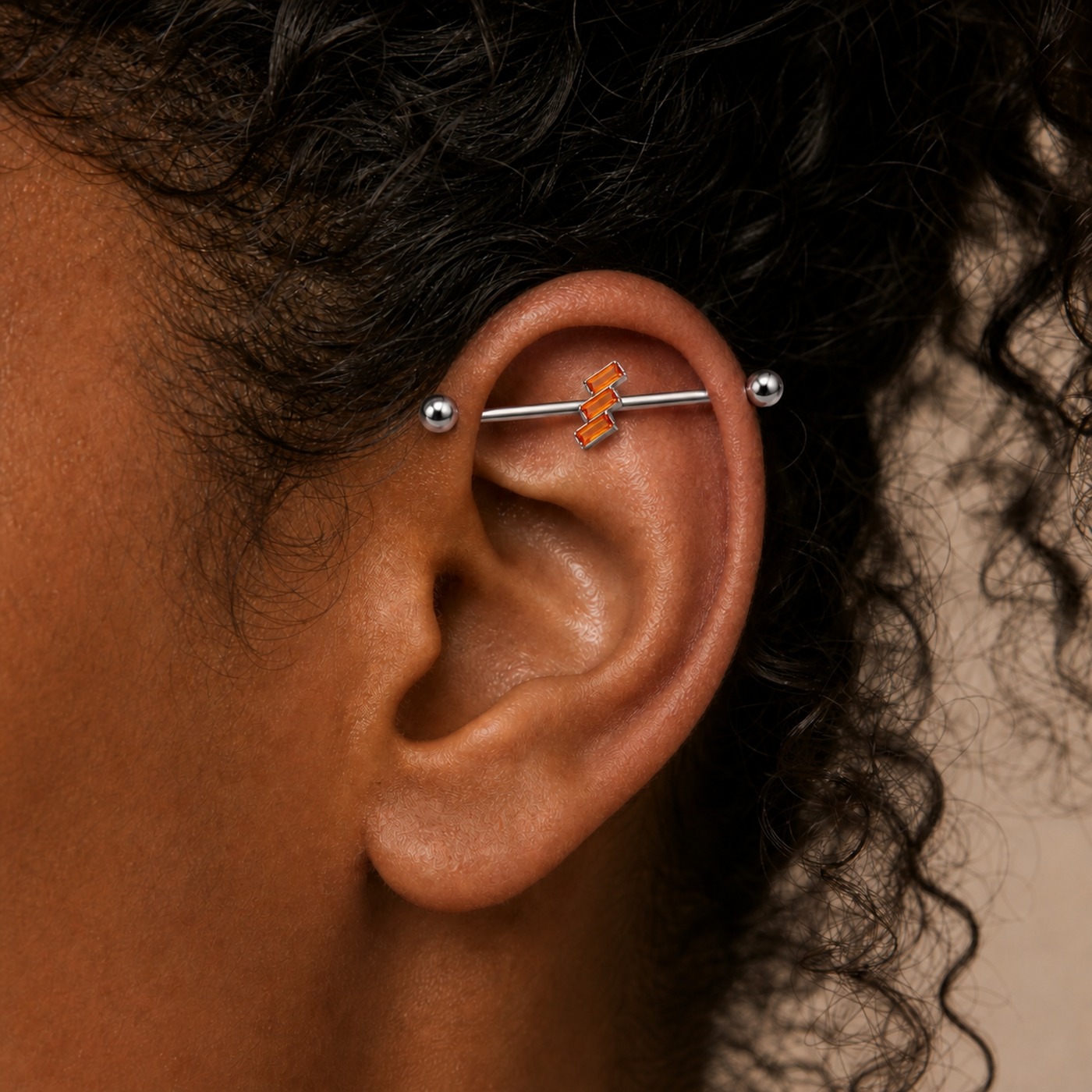 G23 Titanium Three Baguette Industrial Barbell Earring worn on one ear