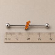 G23 Titanium Three Baguette Industrial Barbell Earring shown at fingertip scale