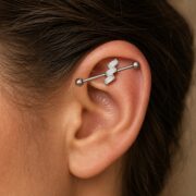 G23 Titanium Three Baguette Industrial Barbell Earring in Natural Titanium worn on one ear