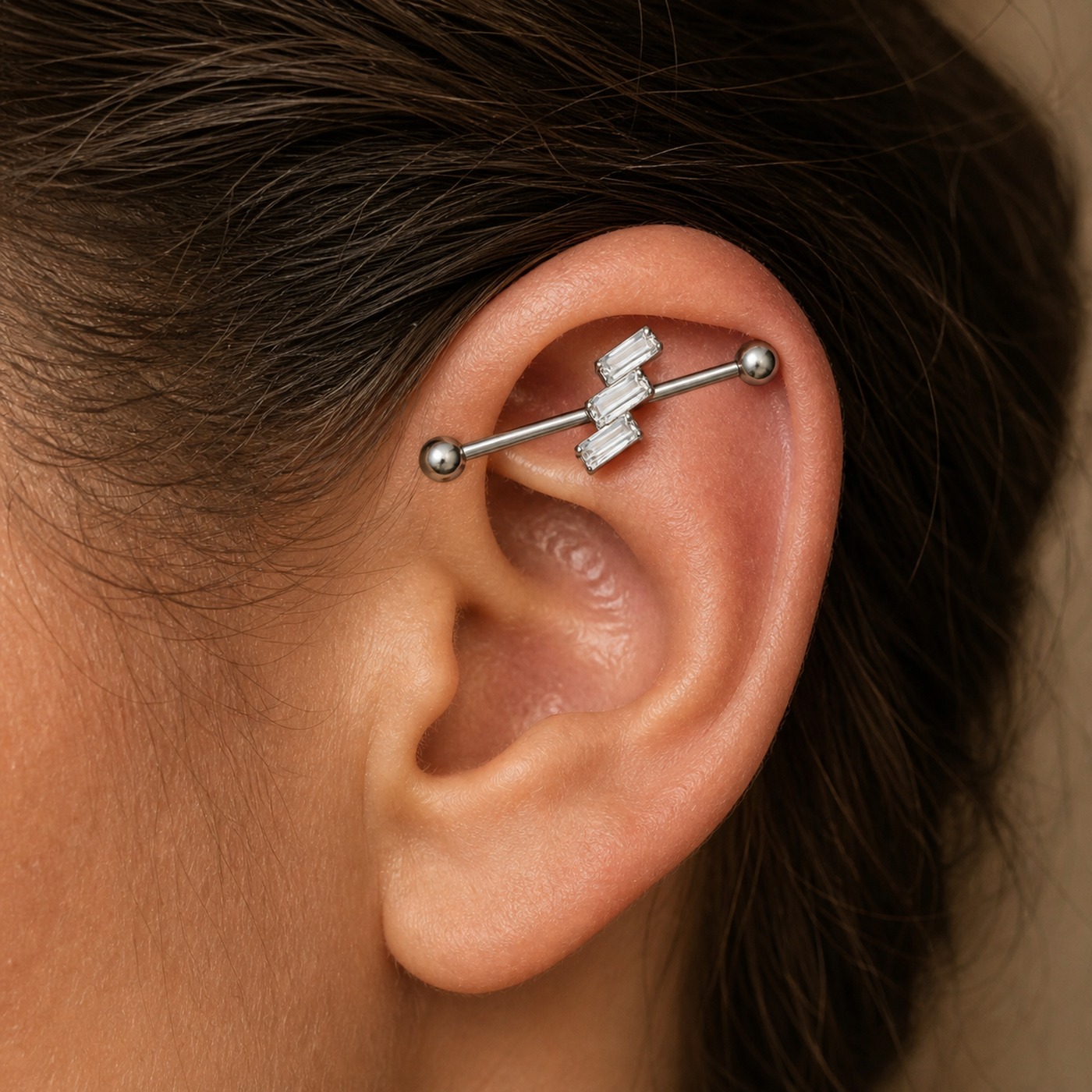 G23 Titanium Three Baguette Industrial Barbell Earring in Natural Titanium worn on one ear