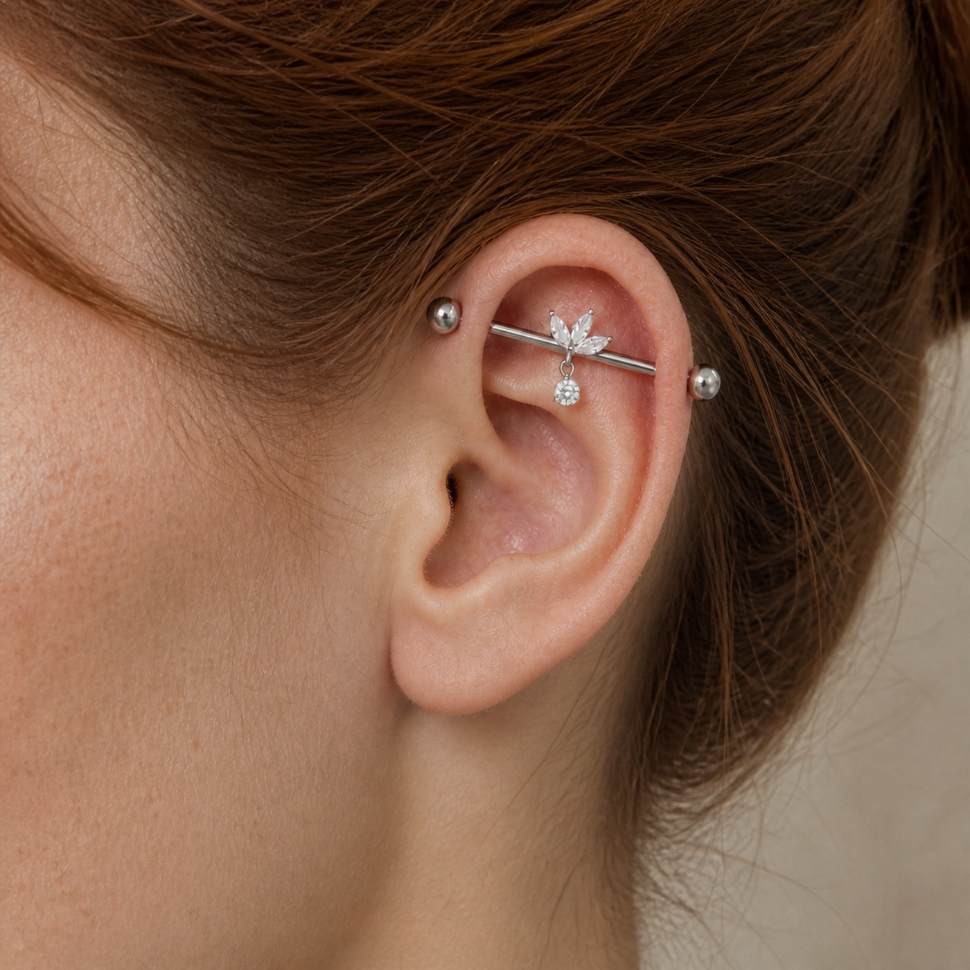G23 Titanium Marquise Dangle Industrial Barbell Earring in Natural Titanium worn on one ear