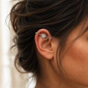 G23 Titanium Double Heart Industrial Barbell Earring in Natural Titanium worn on one ear