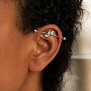 G23 Titanium Marquise Arc Industrial Barbell Earring in Natural Titanium worn on one ear
