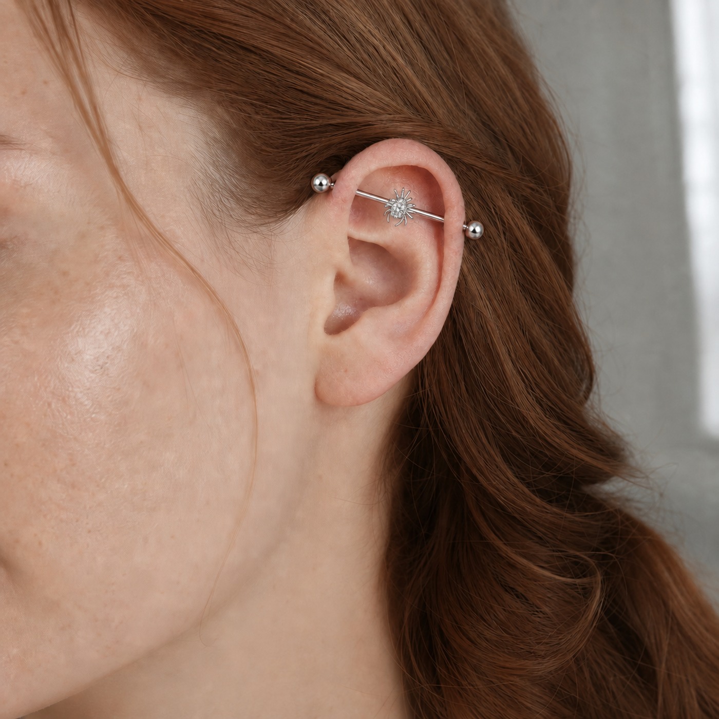 G23 Titanium Spider Crystal Industrial Barbell Earring in Natural Titanium worn on one ear