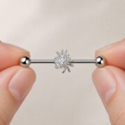 G23 Titanium Spider Crystal Industrial Barbell Earring in Natural Titanium shown at fingertip scale