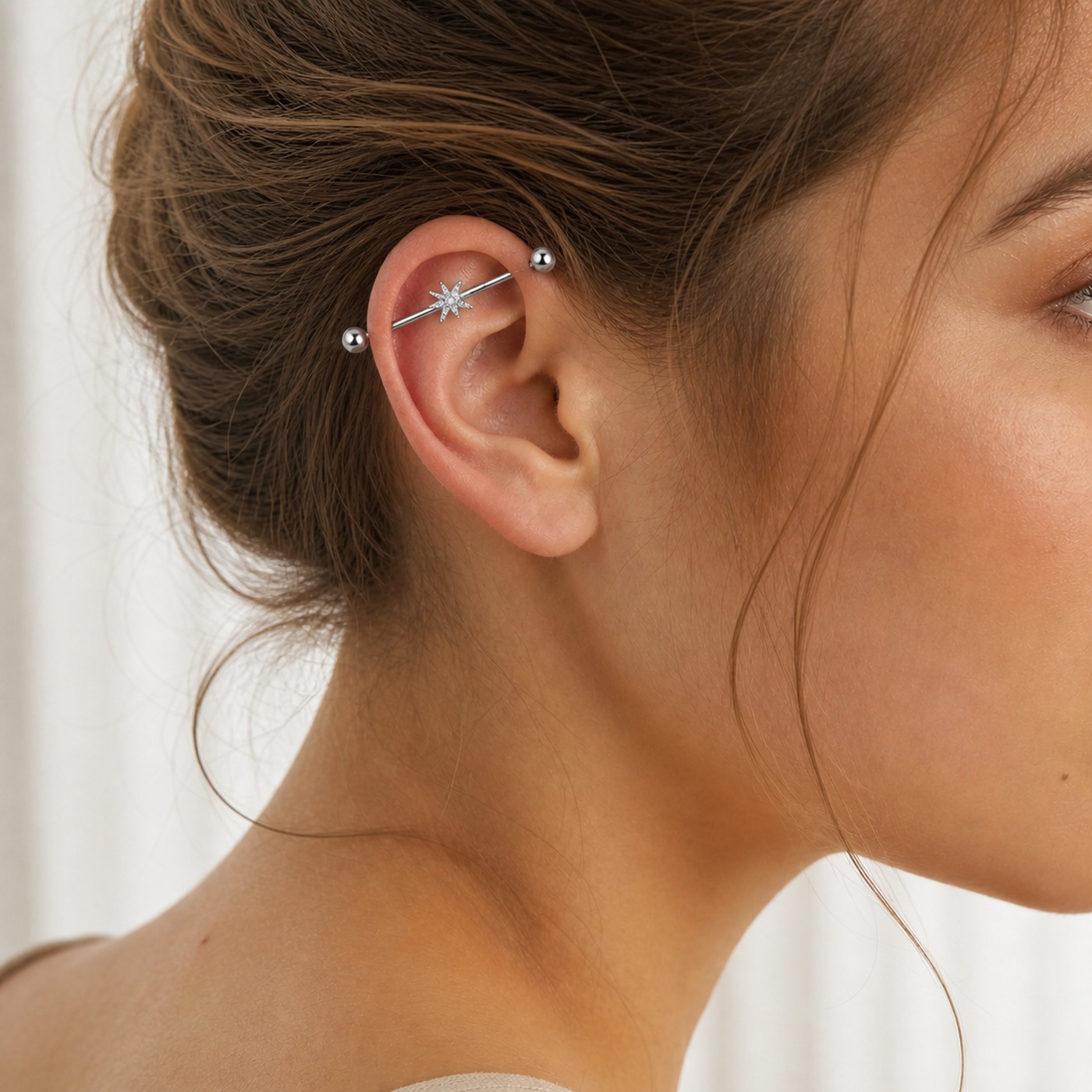 G23 Titanium North Star Crystal Industrial Barbell Earring in Natural Titanium worn on one ear