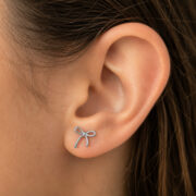Titanium Flat Back Earrings – Outline Bow Cartilage Stud - worn on one ear