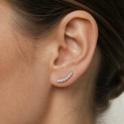 Titanium Flat Back Earrings – Graduated Zircon Arc - worn on one ear