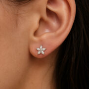 Titanium Flat Back Earrings – Zircon Flower Stud - worn on one ear