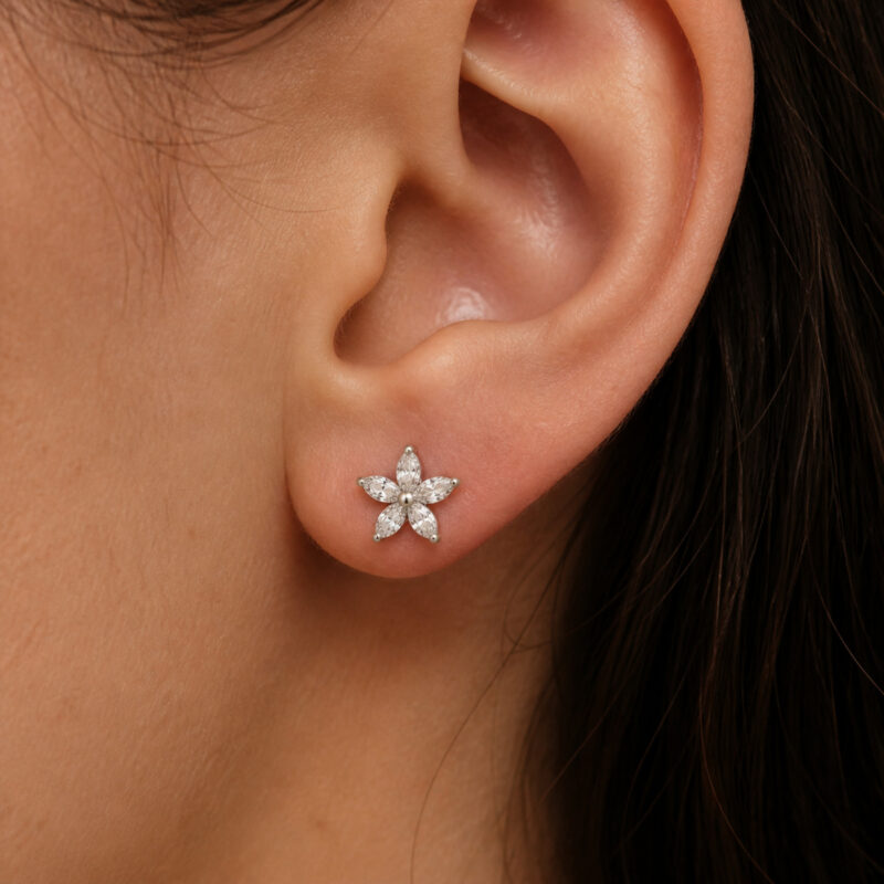 Titanium Flat Back Earrings – Zircon Flower Stud - worn on one ear