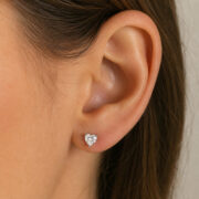 Titanium Flat Back Earrings – Clear Zircon Heart Stud - worn on one ear