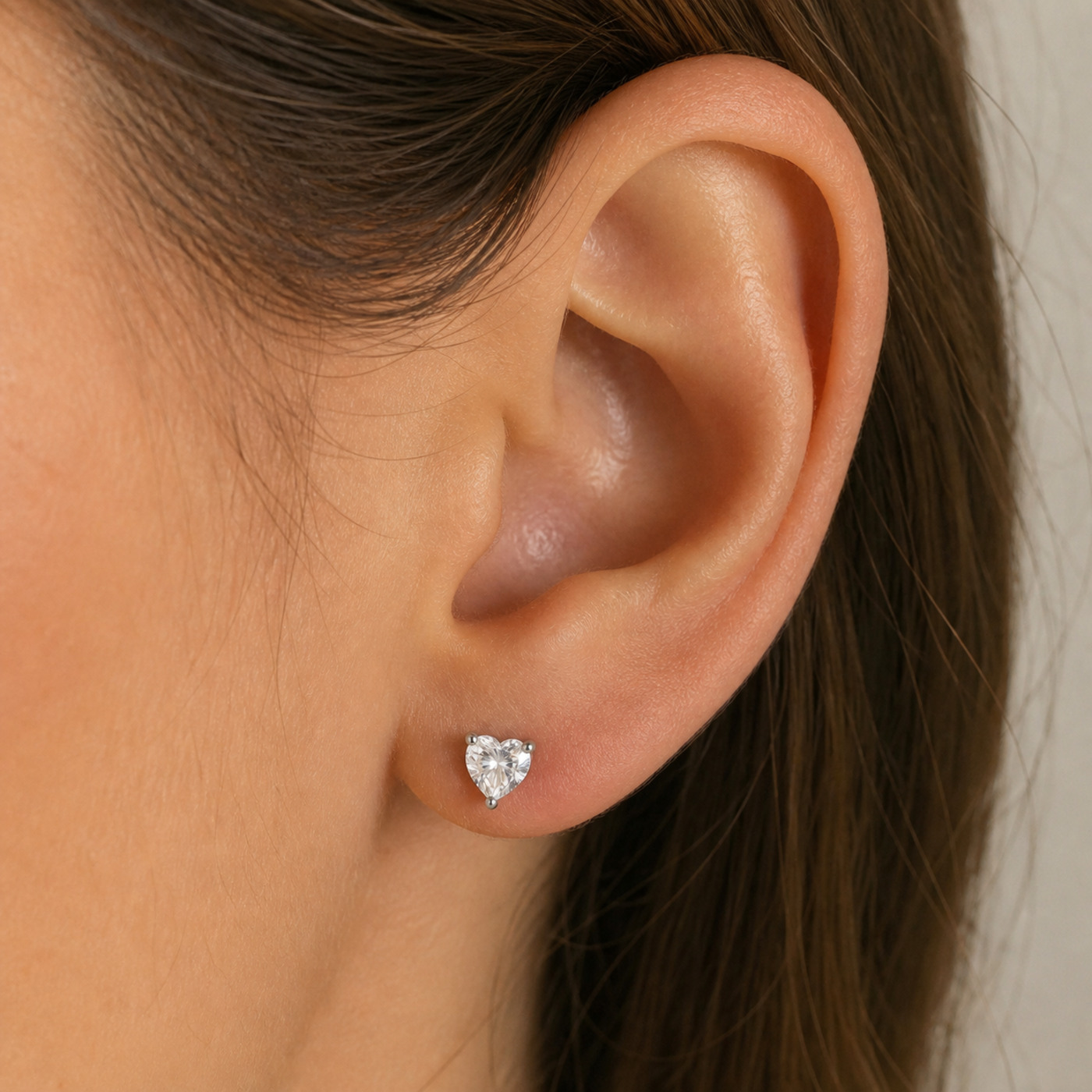 Titanium Flat Back Earrings – Clear Zircon Heart Stud - worn on one ear