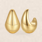 Stud Earrings Moda Teardrop Dome with S925 Silver on warm ivory background