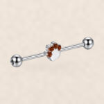 G23 Titanium Cat Paw Crystal Industrial Barbell Earring on warm ivory background