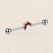 G23 Titanium Cat Paw Crystal Industrial Barbell Earring on warm ivory background