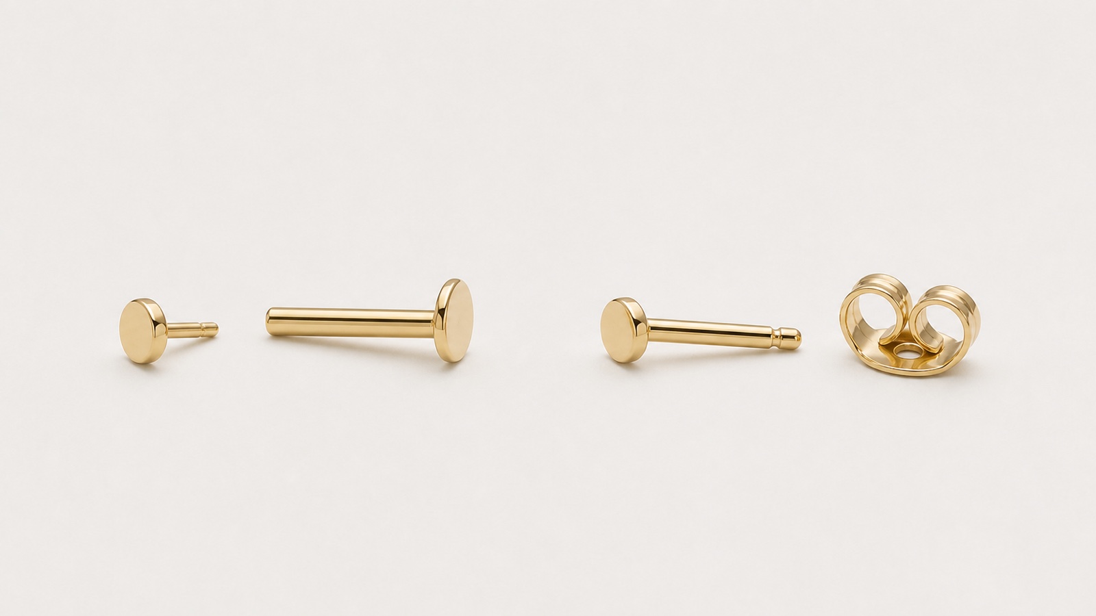 Flat-back labret components and a butterfly-back stud system shown side by side