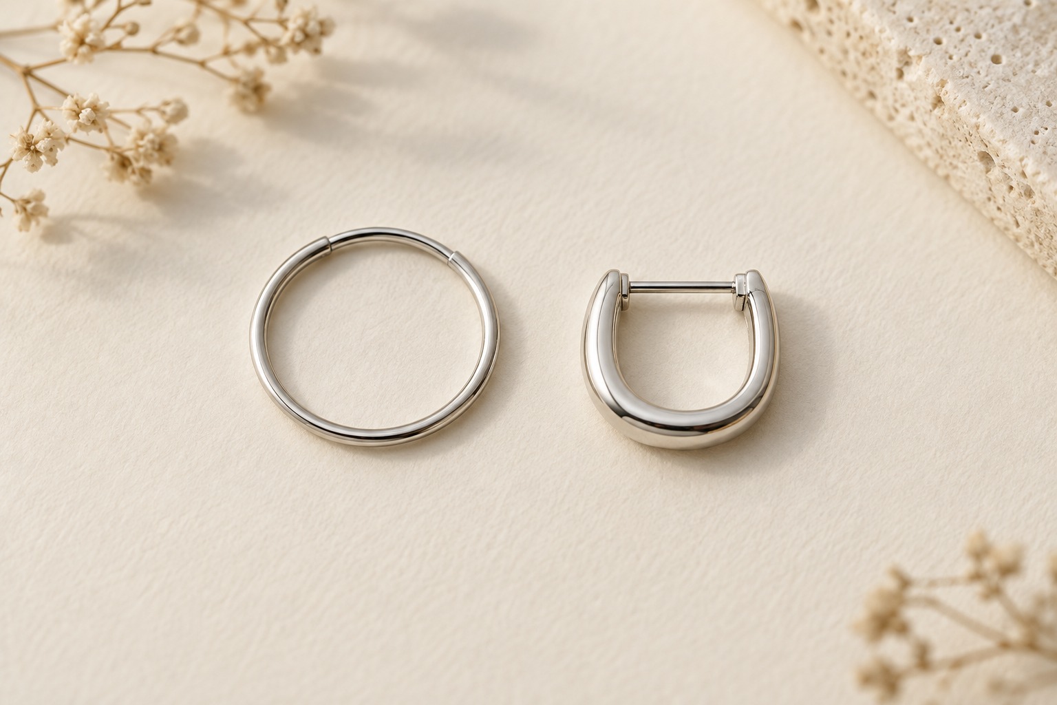 A circular hoop beside a D-shaped hoop with a straight top post.